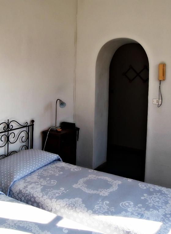 Postel nebo postele na pokoji v ubytování Hotel Villa Furia