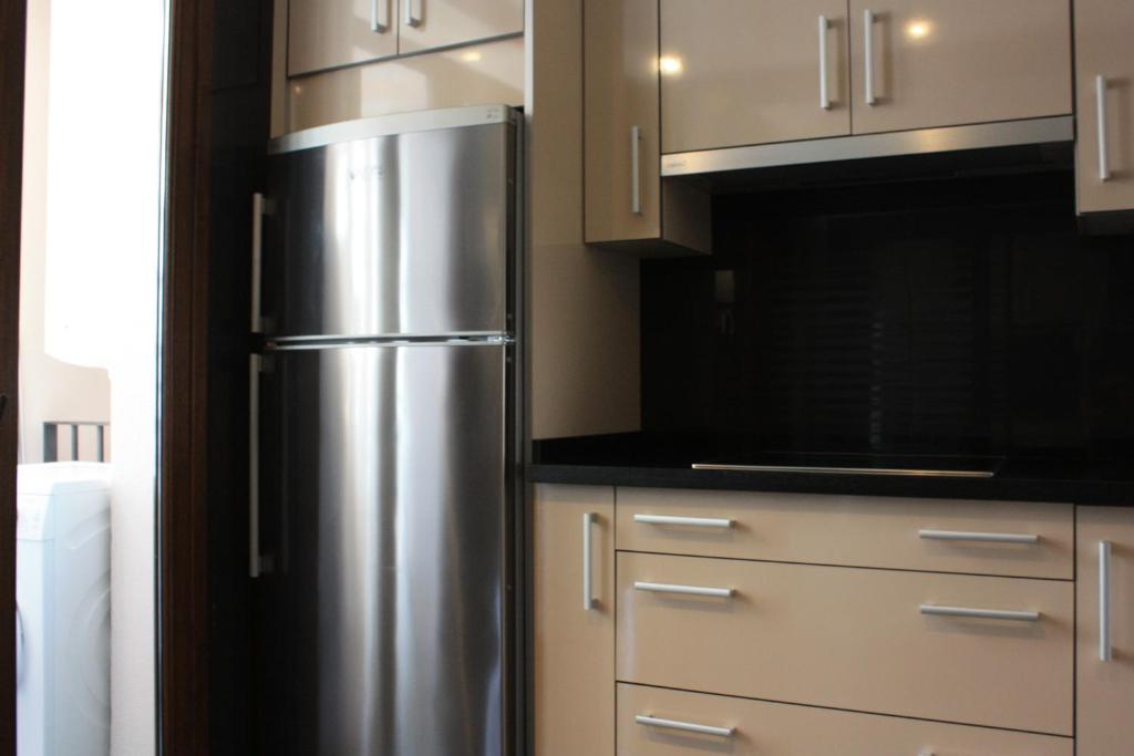 Kuchyň nebo kuchyňský kout v ubytování Bahía Boutique Apartments
