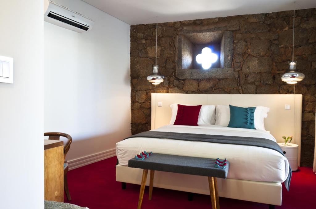 Uma cama ou camas num quarto em Cerca Design House