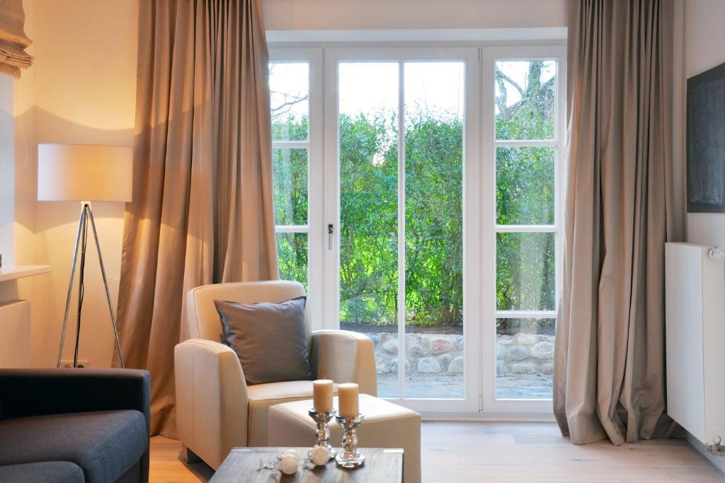 Posezení v ubytování Rackmers Hof - Suiten Hotel garni mit Sauna