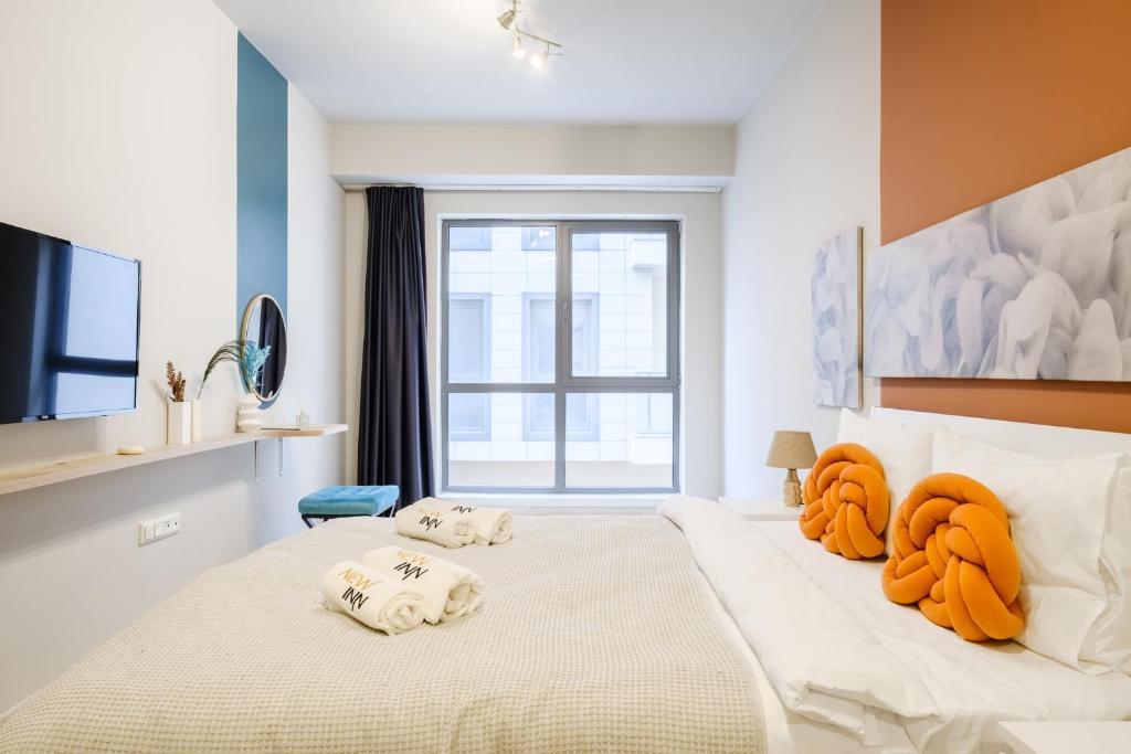 Postel nebo postele na pokoji v ubytování NewInn Hotel Apartments - Cadde 54 Mall