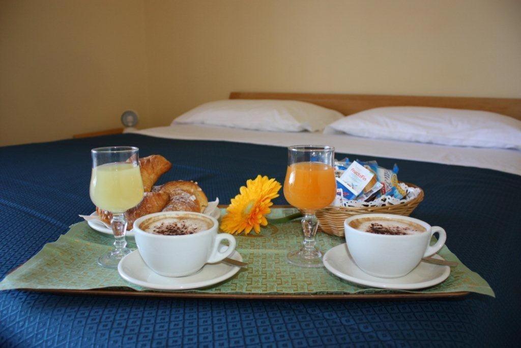 Łóżko lub łóżka w pokoju w obiekcie Hotel Turismo