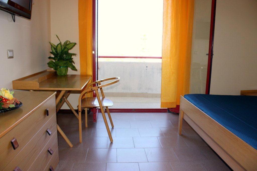 Łóżko lub łóżka w pokoju w obiekcie Hotel Turismo