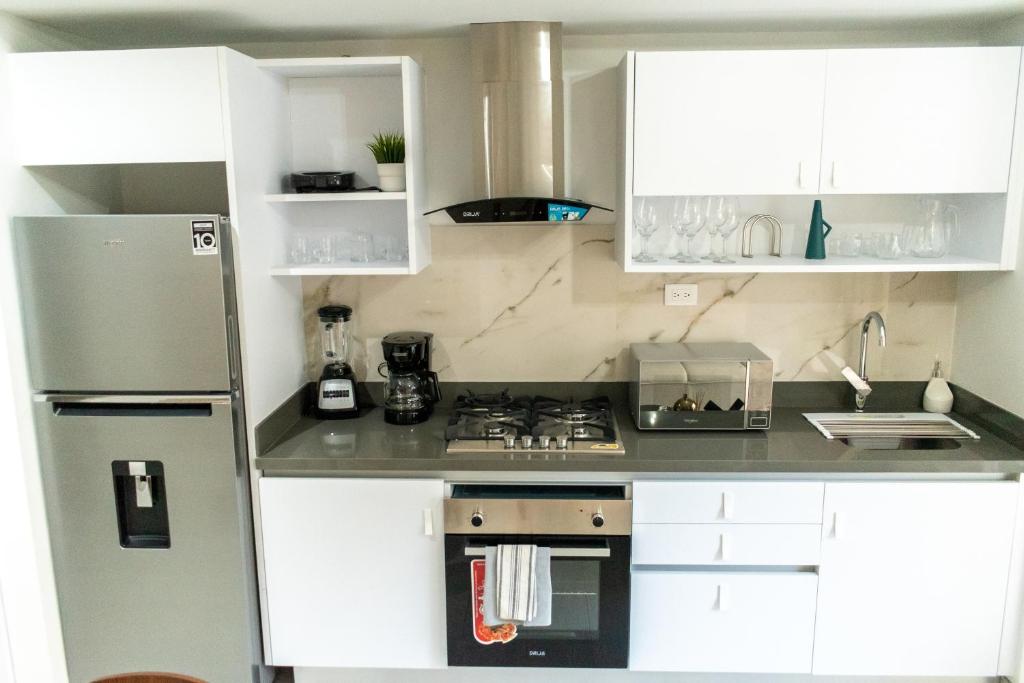 Kuchyň nebo kuchyňský kout v ubytování Brickell Apart Hotel