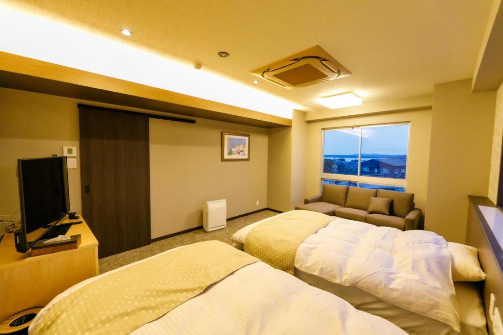 Postel nebo postele na pokoji v ubytování Ise-Shima Ohtaya Healing Stay