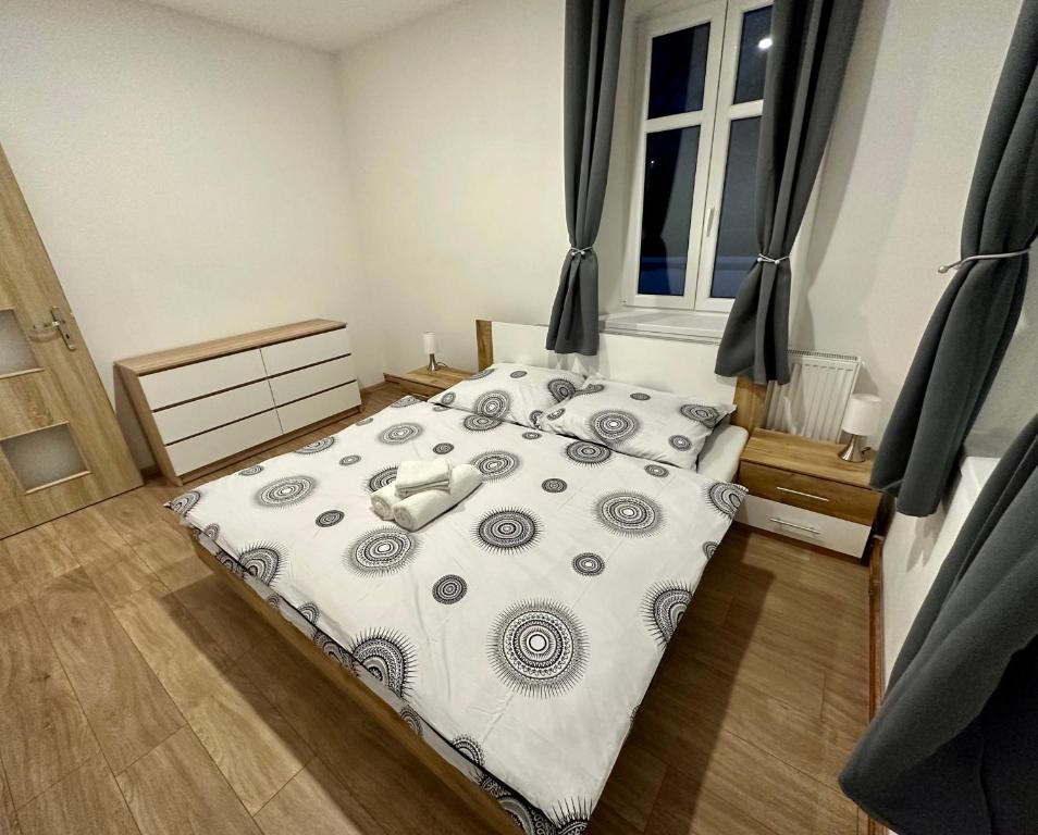 Postel nebo postele na pokoji v ubytování Jizerské apartmány Ha&Ha