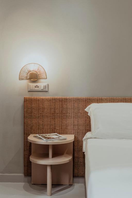 Postel nebo postele na pokoji v ubytování Hotel Marisa