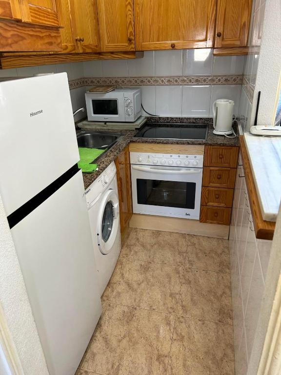Kuchyň nebo kuchyňský kout v ubytování Apartament Mariha