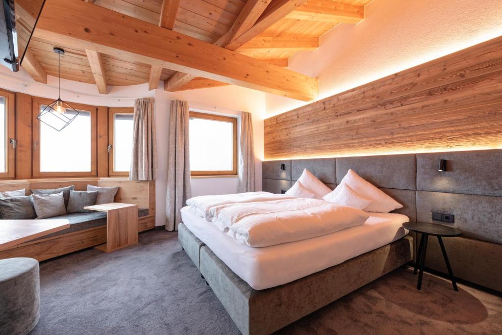 Postel nebo postele na pokoji v ubytování Hotel Garni Feuerstein