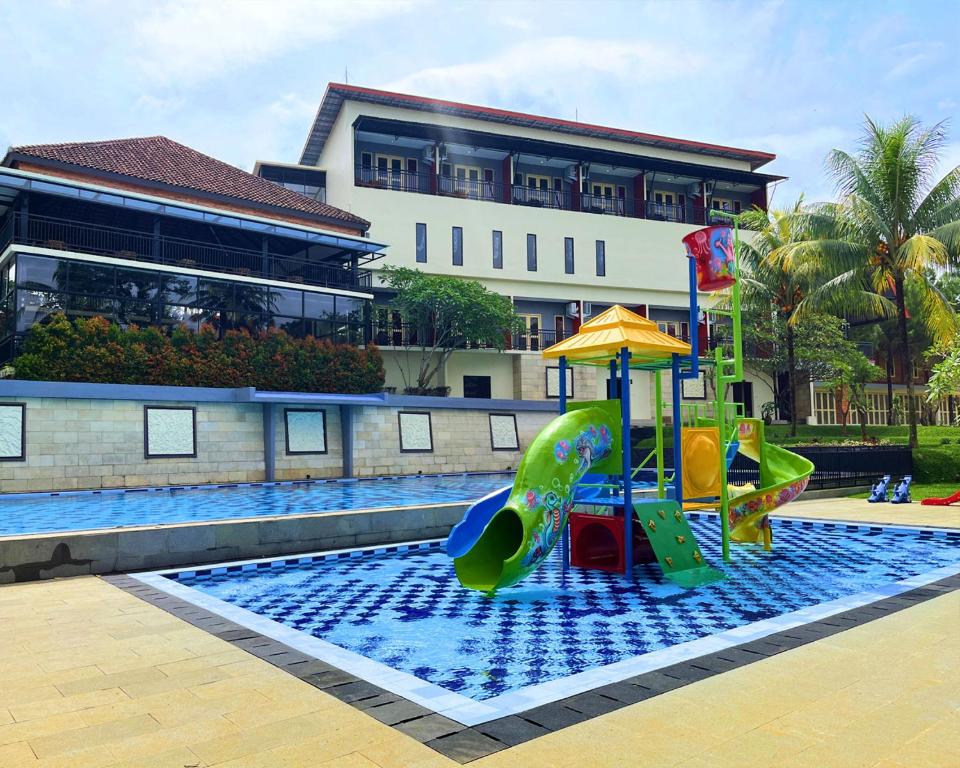 a playground in a swimming pool with a slide at Asyana Sentul Bogor in Bogor