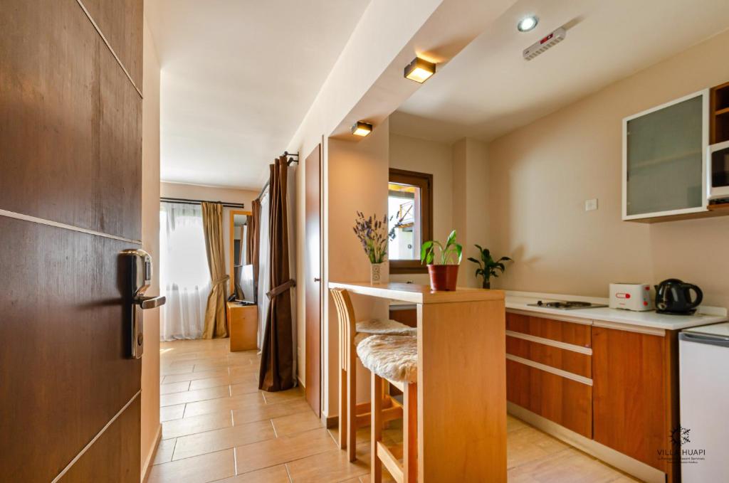 Kuchyň nebo kuchyňský kout v ubytování Villa Huapi