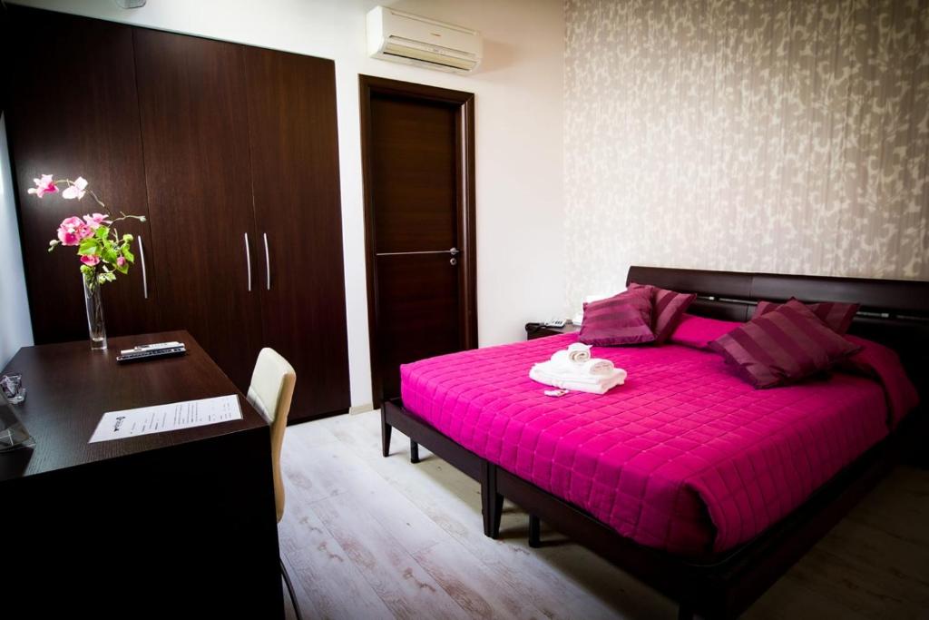 Postel nebo postele na pokoji v ubytování Abraxia B&B