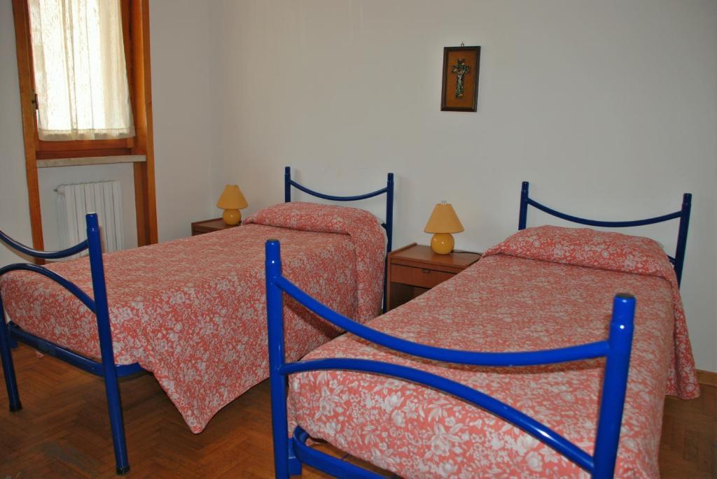 Postel nebo postele na pokoji v ubytování B&B Al Giardino