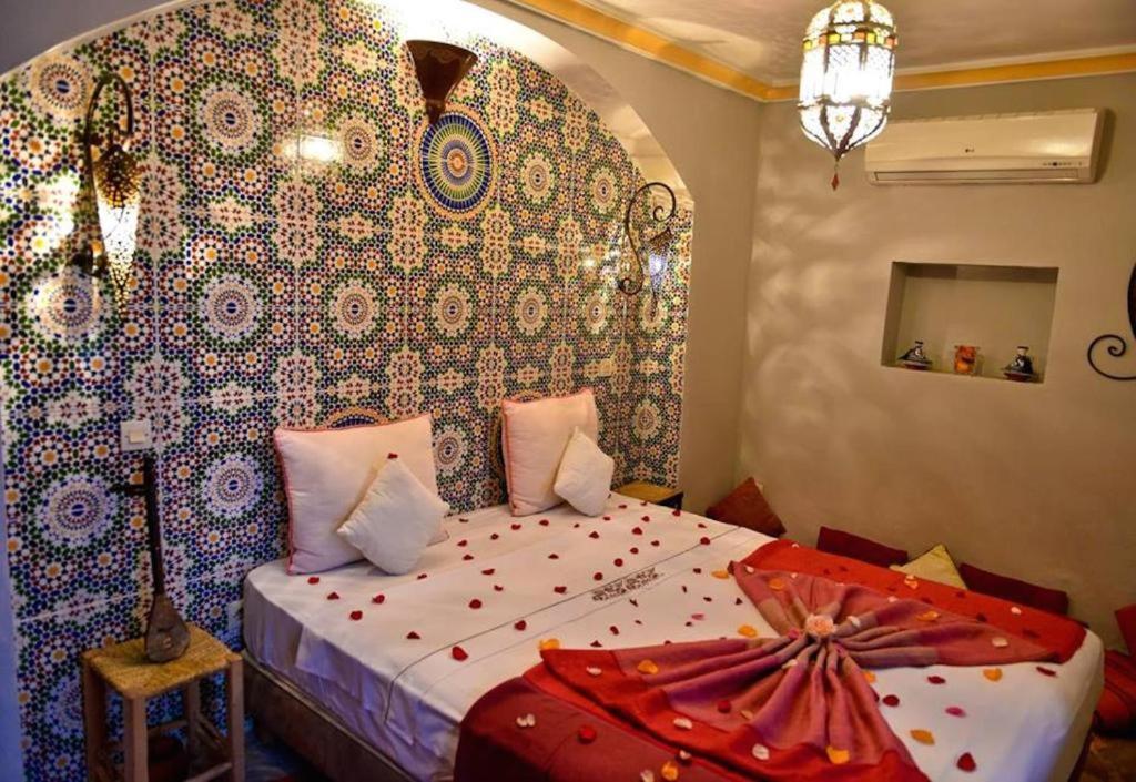 Postel nebo postele na pokoji v ubytování riad dar saba shika