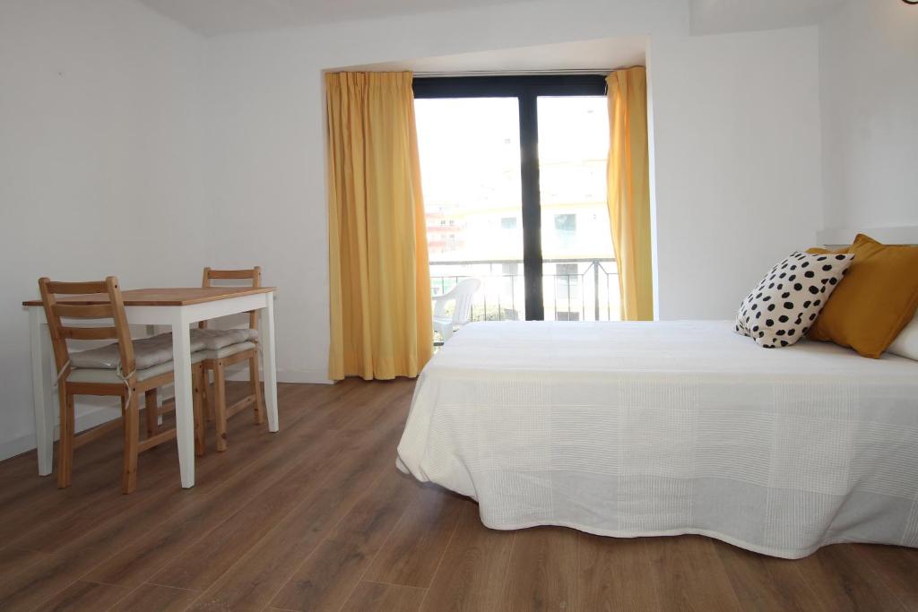 Posteľ alebo postele v izbe v ubytovaní Apartamentos El Sol II