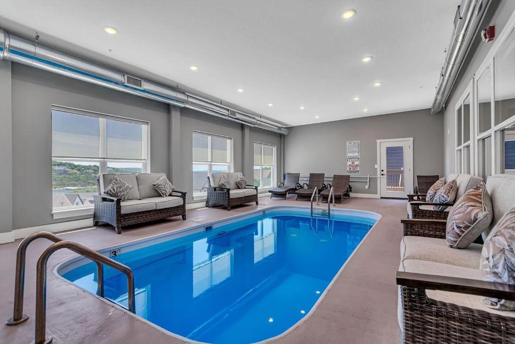 a large swimming pool in a living room at Give Us This Day Chalet in Hollister