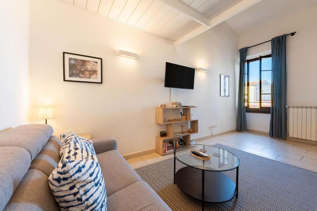 Televízia a/alebo spoločenská miestnosť v ubytovaní Porcellana Apartment