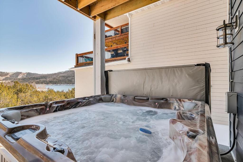 a hot tub on the back of a house at Absolutely Shore in Hollister