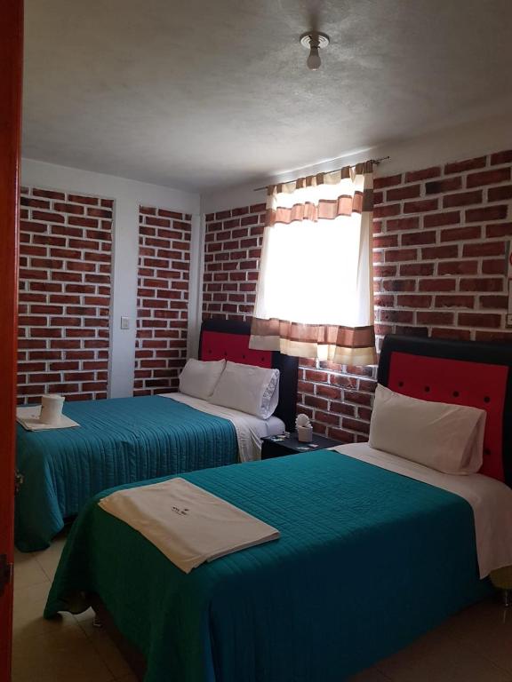 Postel nebo postele na pokoji v ubytování Hotel Fer