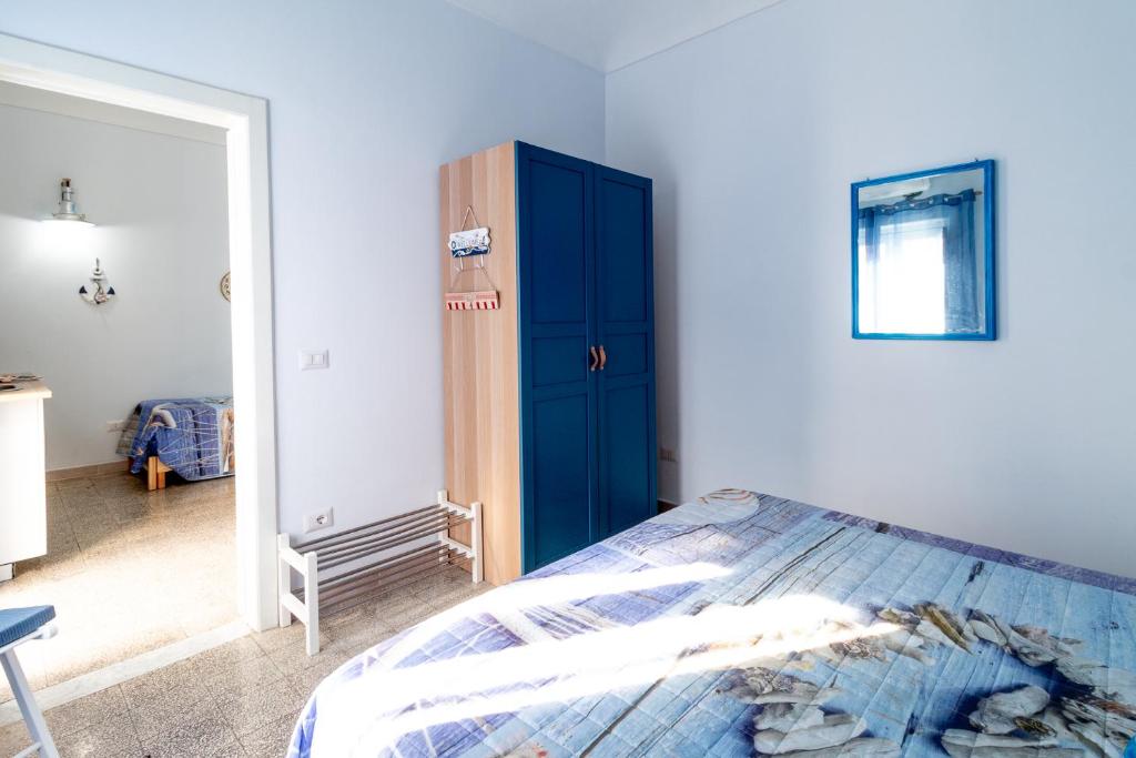 Łóżko lub łóżka w pokoju w obiekcie SyracuseApartments IL PASUBIO di SIRACUSA Stupendo appartamento vicino ad ORTIGIA a 200m dal MARE