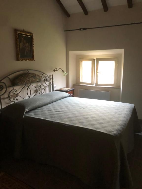 Postel nebo postele na pokoji v ubytování Il Rifugio del Vescovo