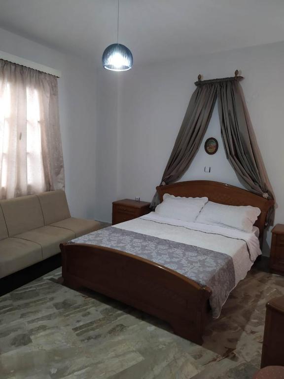Postel nebo postele na pokoji v ubytování Kisiris House