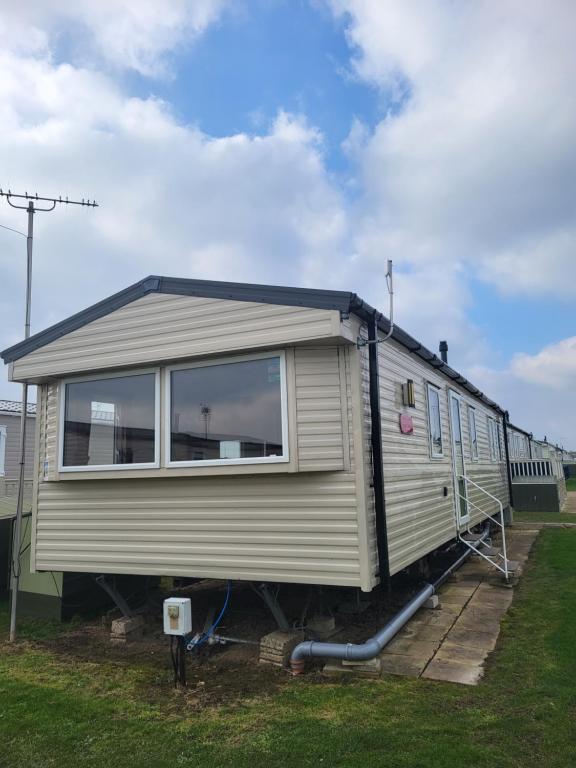 a mobile home is parked in a yard at Beach View in Whitstable