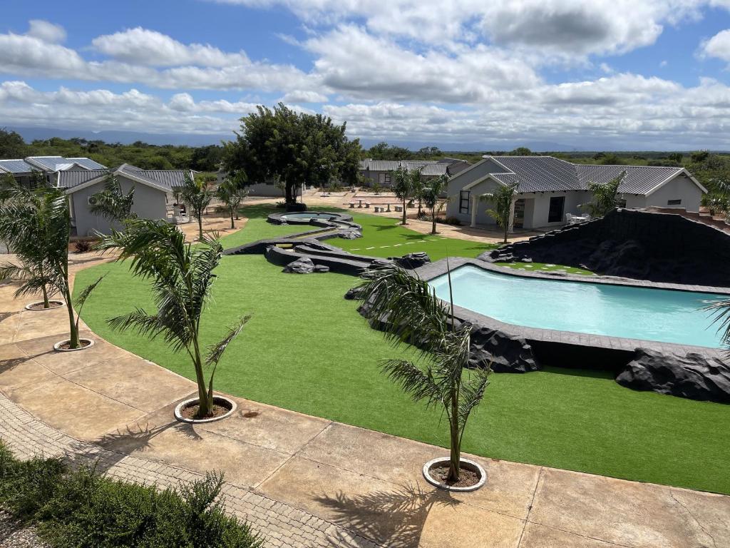 an image of a swimming pool at a resort at Bluewave Farm Villa in Louis Trichardt
