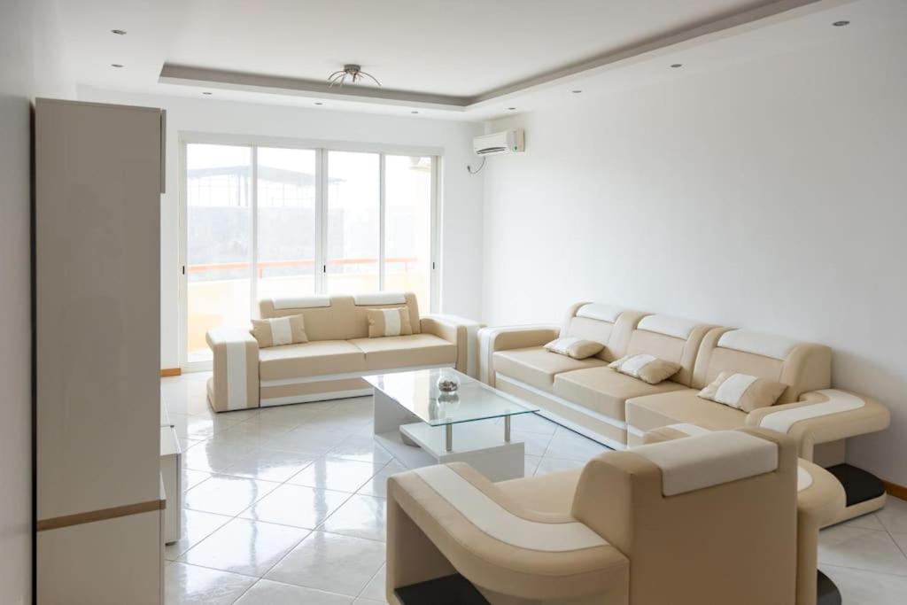 a living room with couches and a coffee table at 3 bedroom apt, Exterior POOL , Cidadela - LCGR in Praia