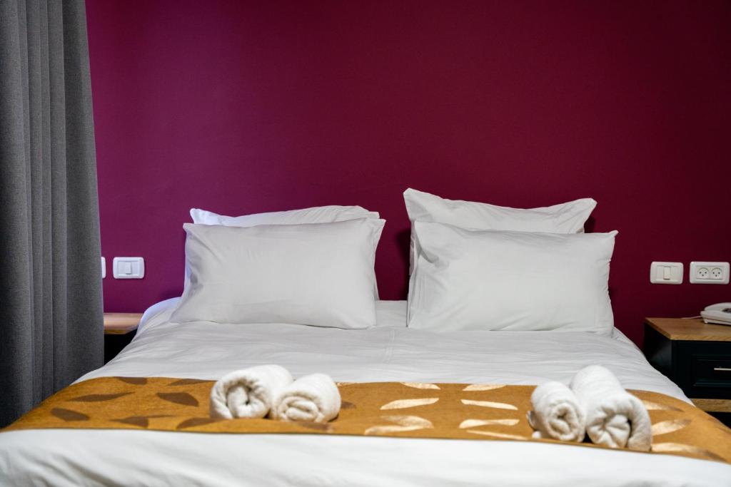 Postel nebo postele na pokoji v ubytování Jerusalem Boutique Hotel