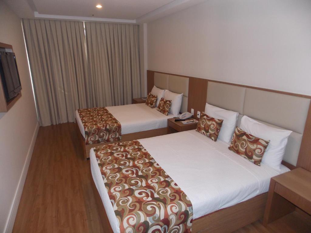 Кровать или кровати в номере Mirador Rio Copacabana Hotel