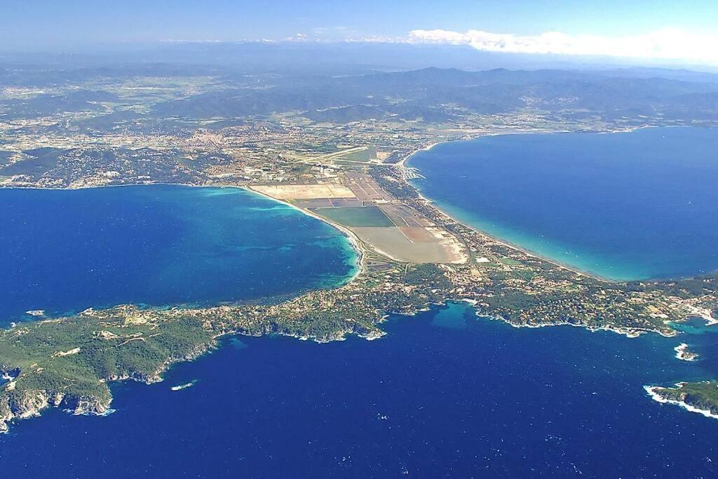 an aerial view of a island in the water at Les Jardins de Provence • Beau Rivage • Proche mer in Carqueiranne