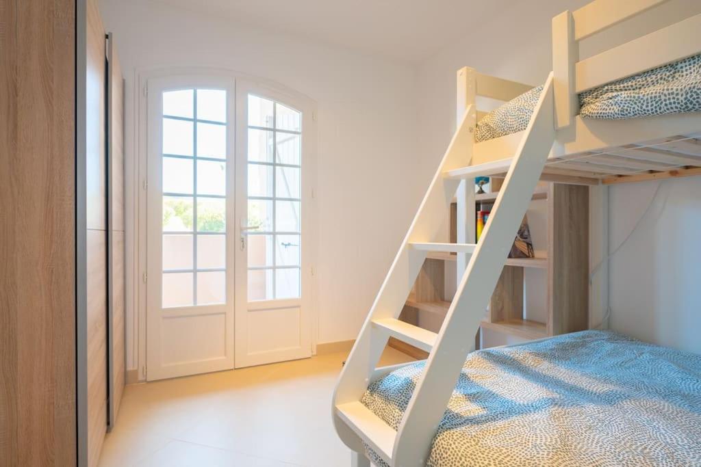 a white bunk bed in a room with a ladder at Les Jardins de Provence • Beau Rivage • Proche mer in Carqueiranne