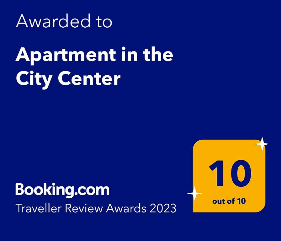a yellow sign that says appointment in the city center at Apartament in the City Center-Old Town in Rokiškis
