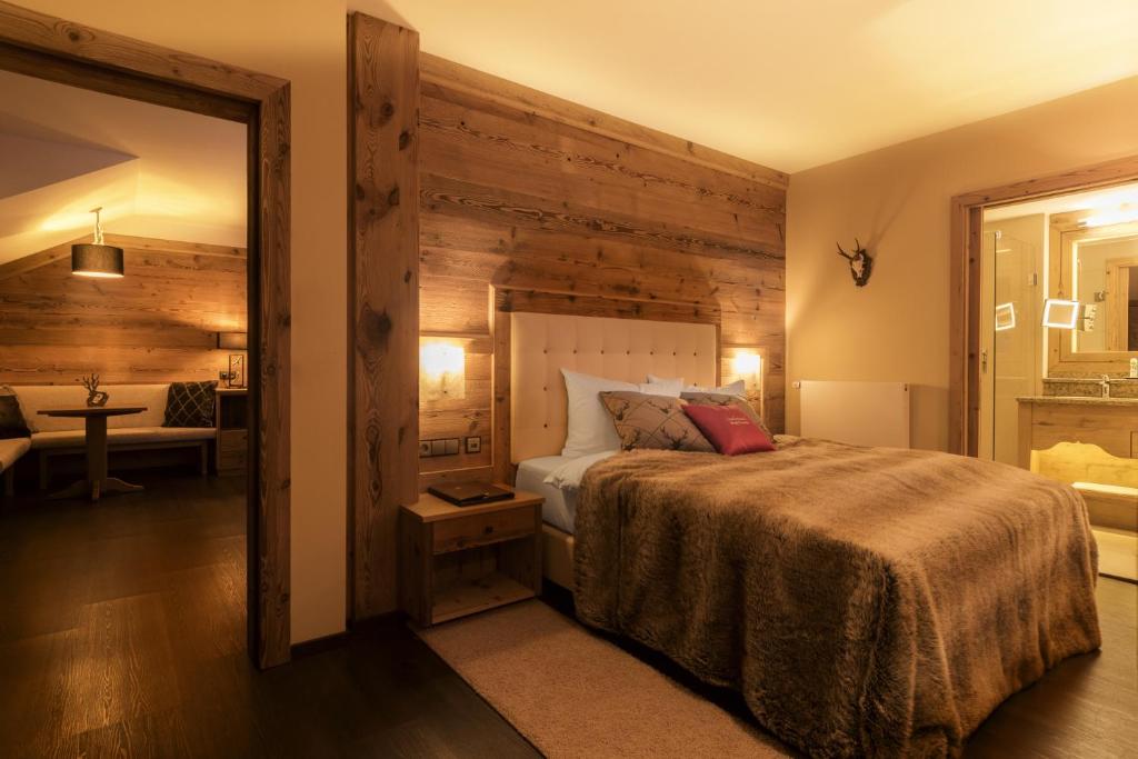 Postel nebo postele na pokoji v ubytování Wellnesshotel Oswald
