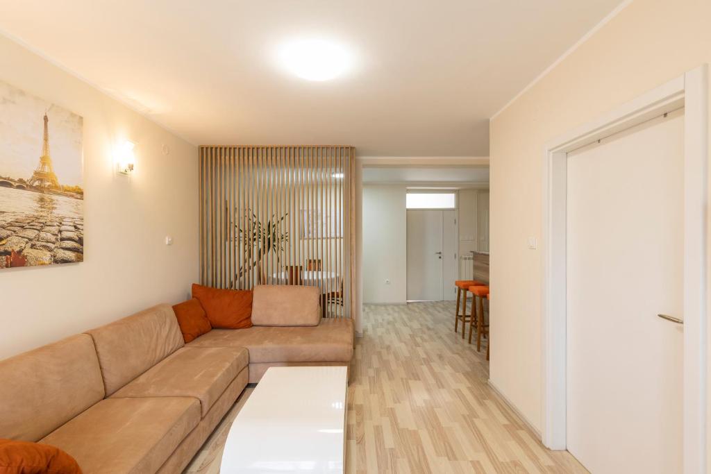 a living room with a couch and a table at DULE’S HOUSE in Belgrade