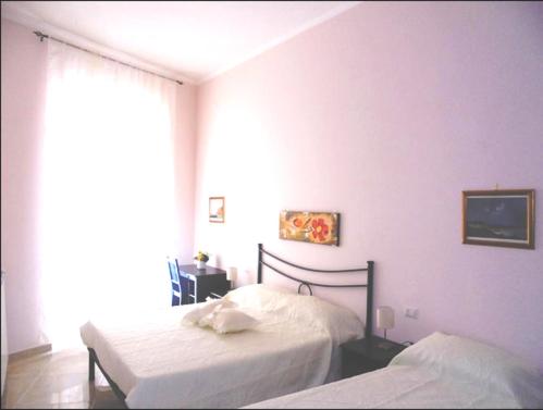 Łóżko lub łóżka w pokoju w obiekcie Domusrealstella