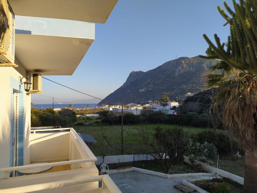 a view from the balcony of a house with a mountain at Dionisia apartments 8 in Kos