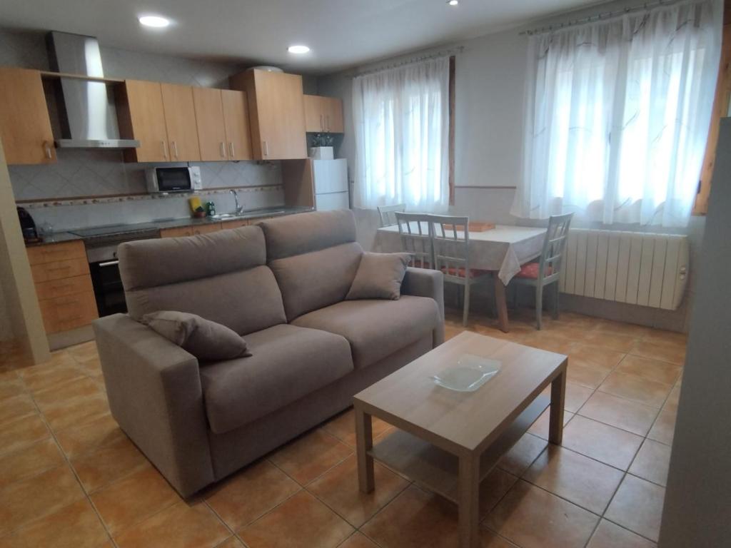 a living room with a couch and a table at Apartamento Torre Sancho in Valderrobres