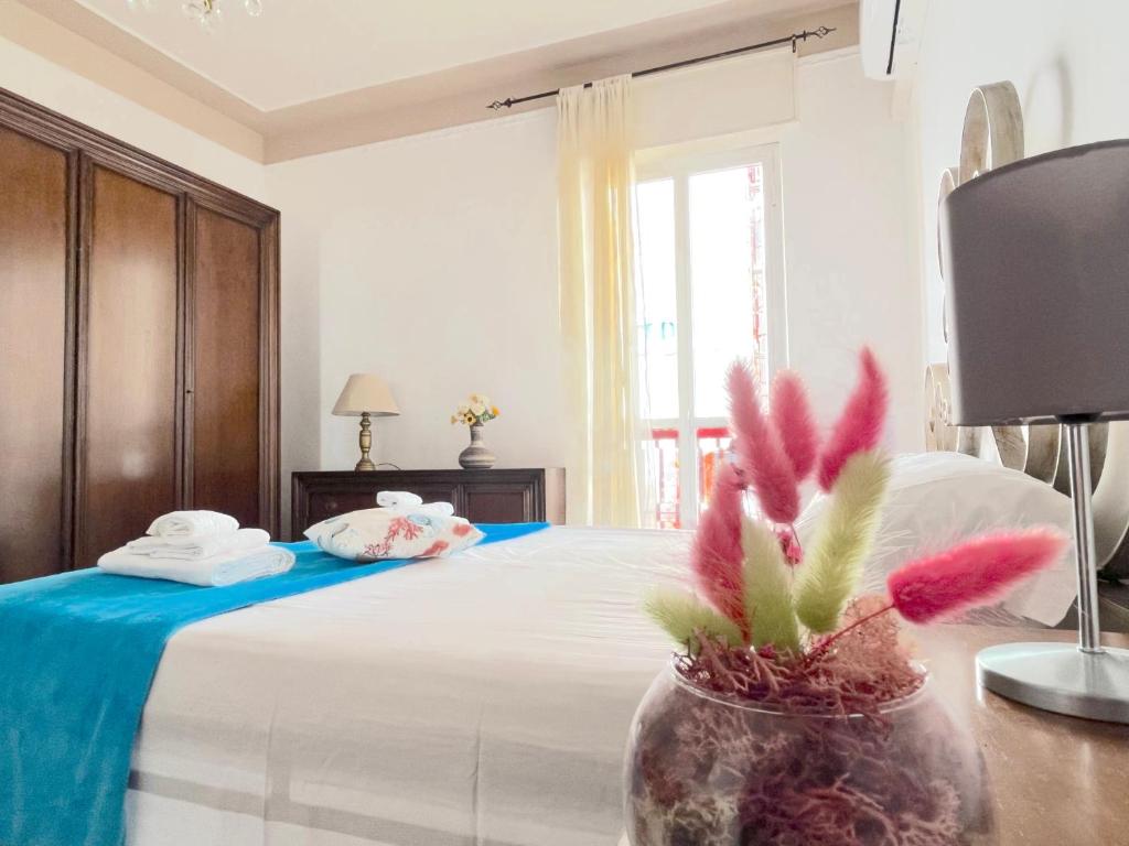 A bed or beds in a room at Odi et Amo - Lido San Giovanni