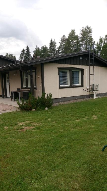 a house with a lawn in front of it at Mesijäinen in Pyhäjärvi