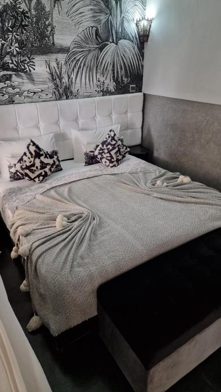 Postel nebo postele na pokoji v ubytování Riad Des Arts