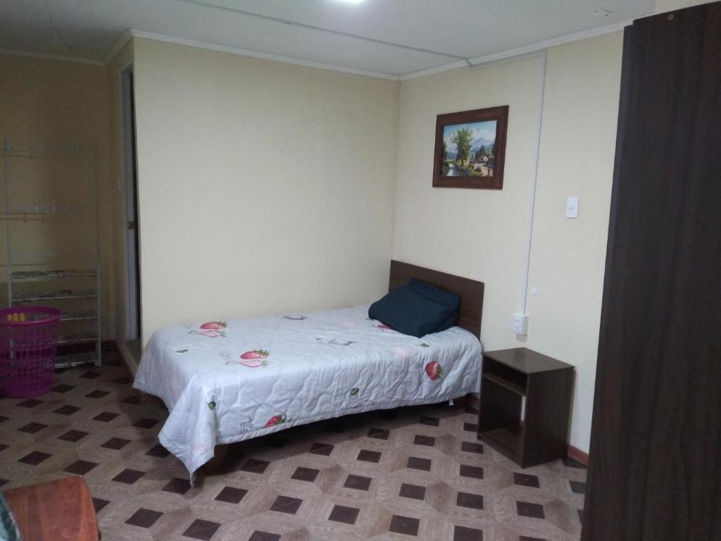 Katil atau katil-katil dalam bilik di Hostal MIRAMAR En Pleno Centro de Pozo Almonte