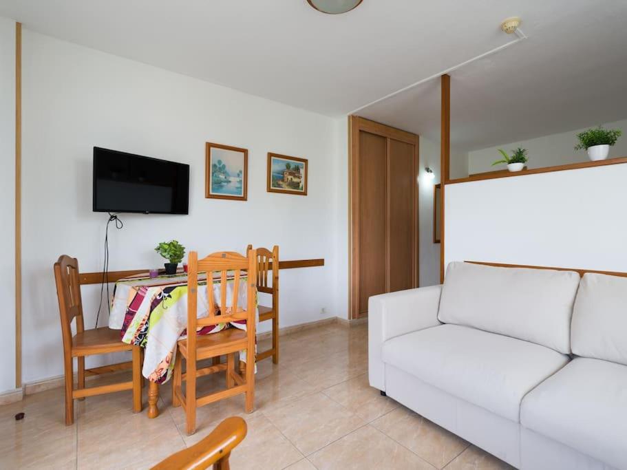 Televízia a/alebo spoločenská miestnosť v ubytovaní Marlenghi Apartments 125