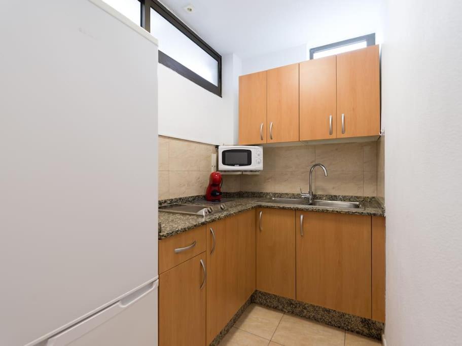 Kuchyňa alebo kuchynka v ubytovaní Marlenghi Apartments 125