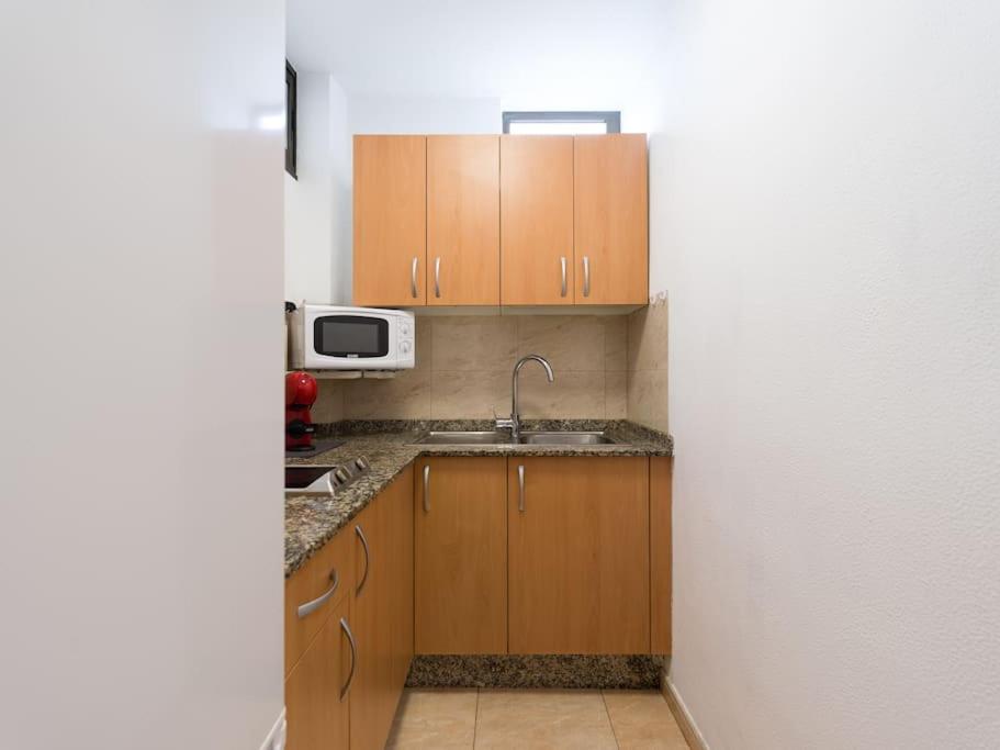 Kuchyňa alebo kuchynka v ubytovaní Marlenghi Apartments 125