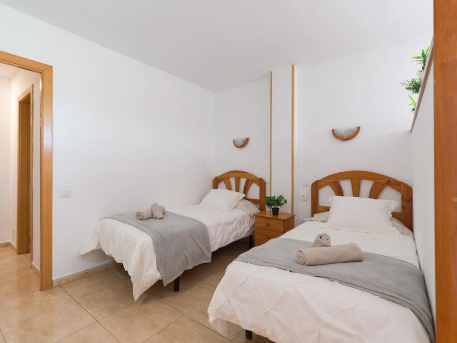 Posteľ alebo postele v izbe v ubytovaní Marlenghi Apartments 125