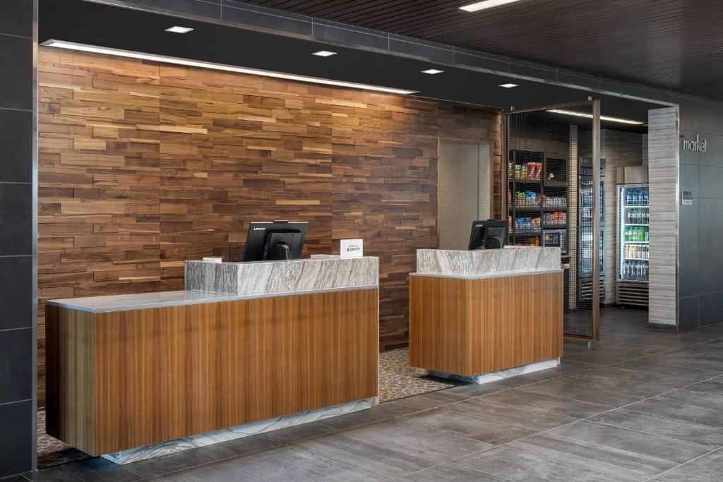 a lobby of a store with two reception desks at Courtyard by Marriott Las Cruces at NMSU in Las Cruces