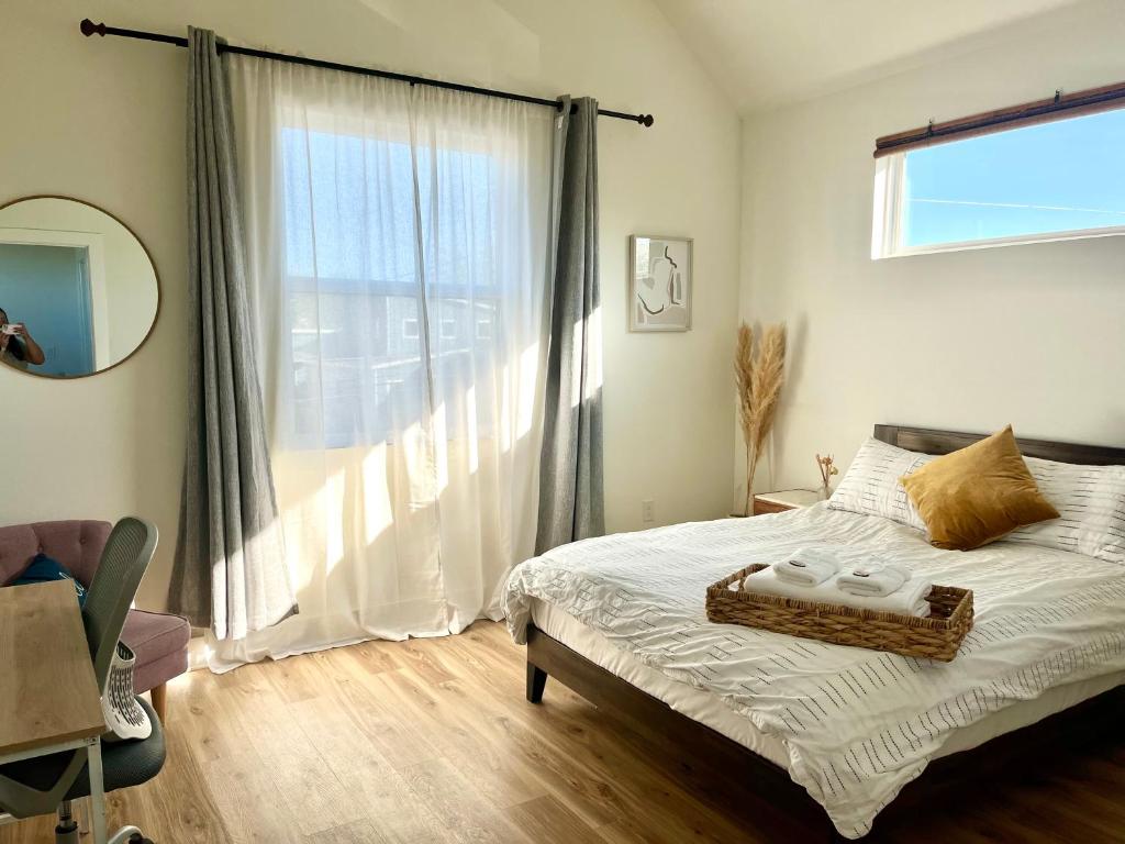 a bedroom with a bed and a large window at Contemporary NEW 10min dt Pet friendly 7min Park-A in Austin