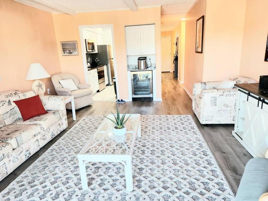 a living room with a couch and a table at Spacious 2 Bedroom and 2 Baths in Ocean City